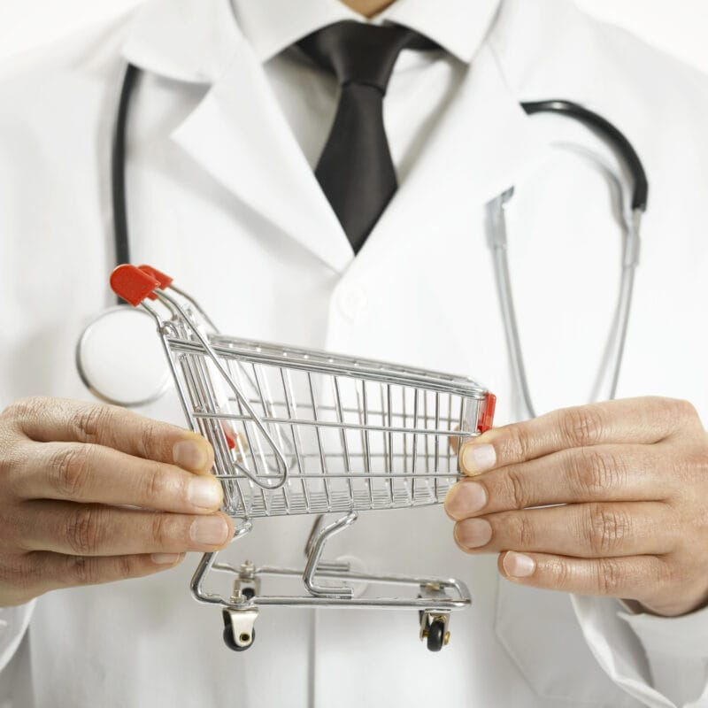 doctor holding small shopping cart