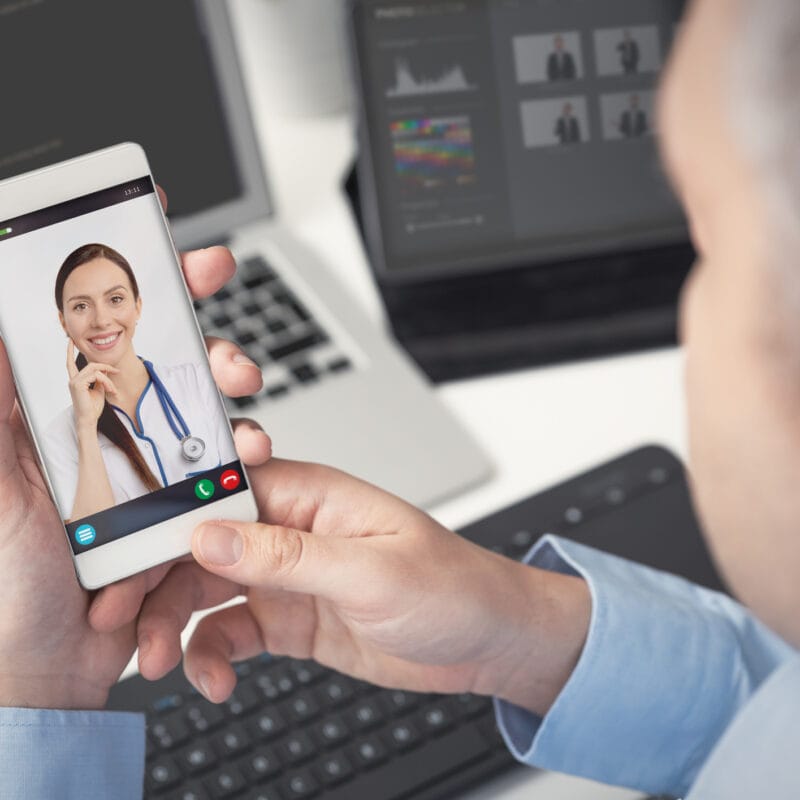 man having video call with woman on smartphone