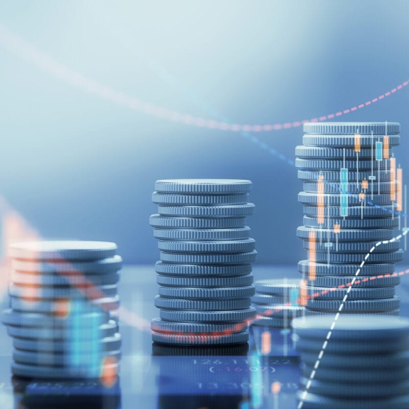 stack of coins and various trendlines showing cost and quality in health care