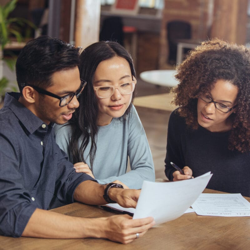 group of people reviewing documents with updates to price transparency mandate