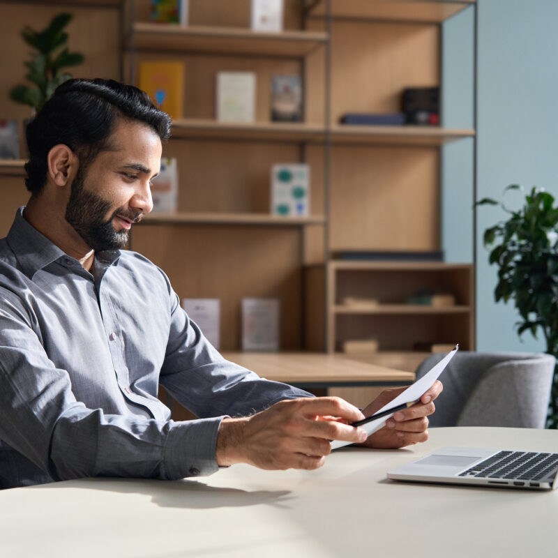 Man using self-service price transparency tool at home