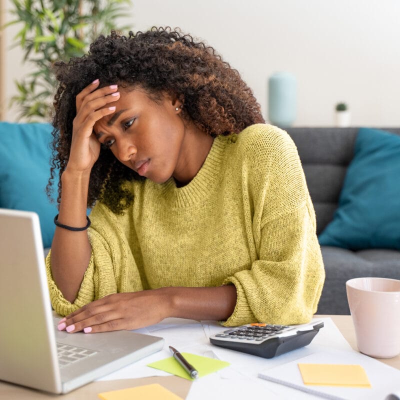 Stressed woman looking for healthcare costs